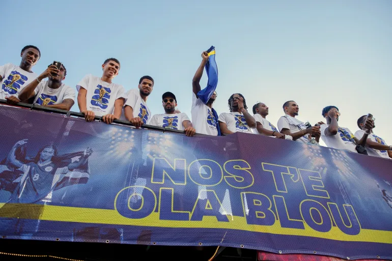 Curaçao players take part in a parade celebrating their qualification for the 2026 FIFA World Cup, in Willemstad, Curacao, Wednesday, Nov. 19, 2025. (AP Photo/Endrymar Martis)