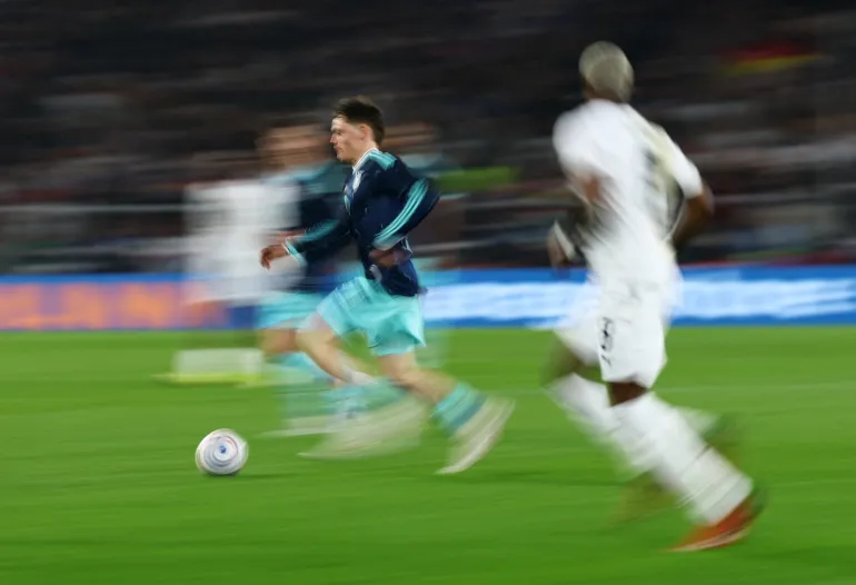 Soccer Football - International Friendly - Germany v Ghana - MHPArena, Stuttgart, Germany - March 30, 2026 Germany's Florian Wirtz in action with Ghana's Kwasi Sibo REUTERS/Kai Pfaffenbach