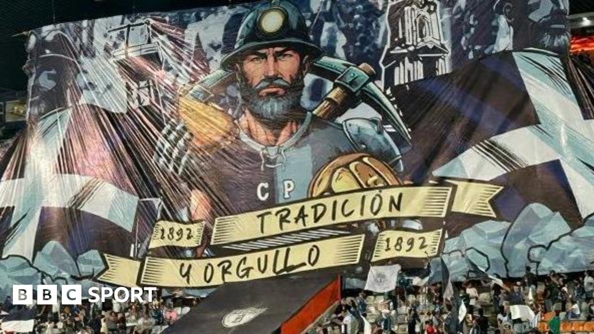 A tifo featuring a miner holding a pasty and a pickaxe