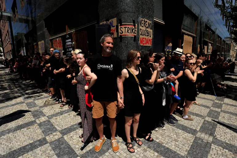 Employees of Czech Radio form a human chain during a warning strike in protest of the government's planned overhaul of public media funding, in Prague, Czech Republic, June 22, 2026. REUTERS/David W Cerny