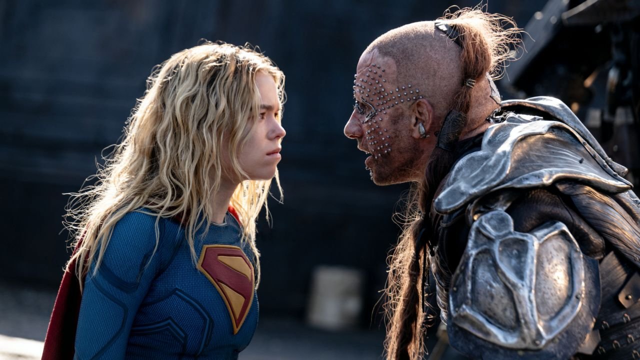 (L to R) Milly Alcock as Supergirl and Matthias Schoenaerts as Krem in DC Studios’ and Warner Bros. Pictures’ 'Supergirl', a Warner Bros. Pictures release. Photo Credit: Photo by Parisa Taghizadeh. Copyright: © 2026 Warner Bros. Entertainment. All Rights Reserved. TM & © DC