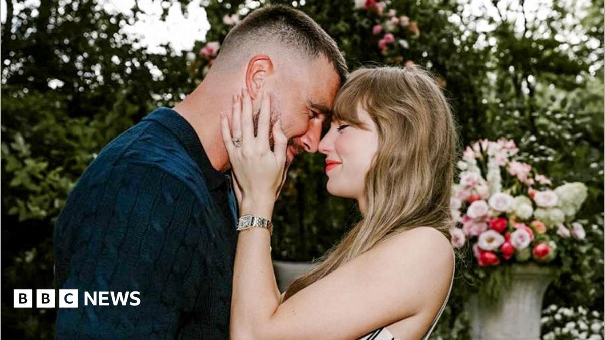 Travis Kelce and Taylor Swift embrace each other on the occassion of their engagement