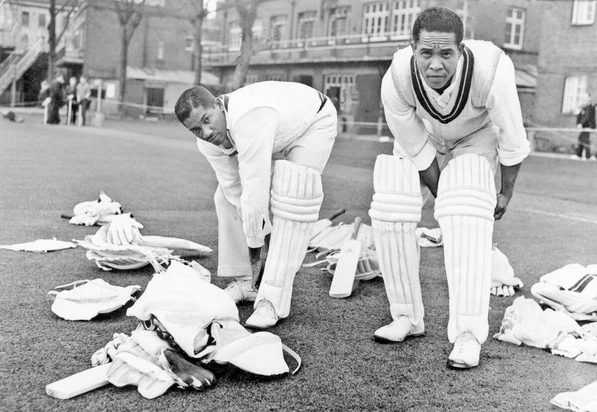 B. Butcher (left) and Garfield Sobers padding up before a spell at the net at Lord’s on April 19, 1963.
