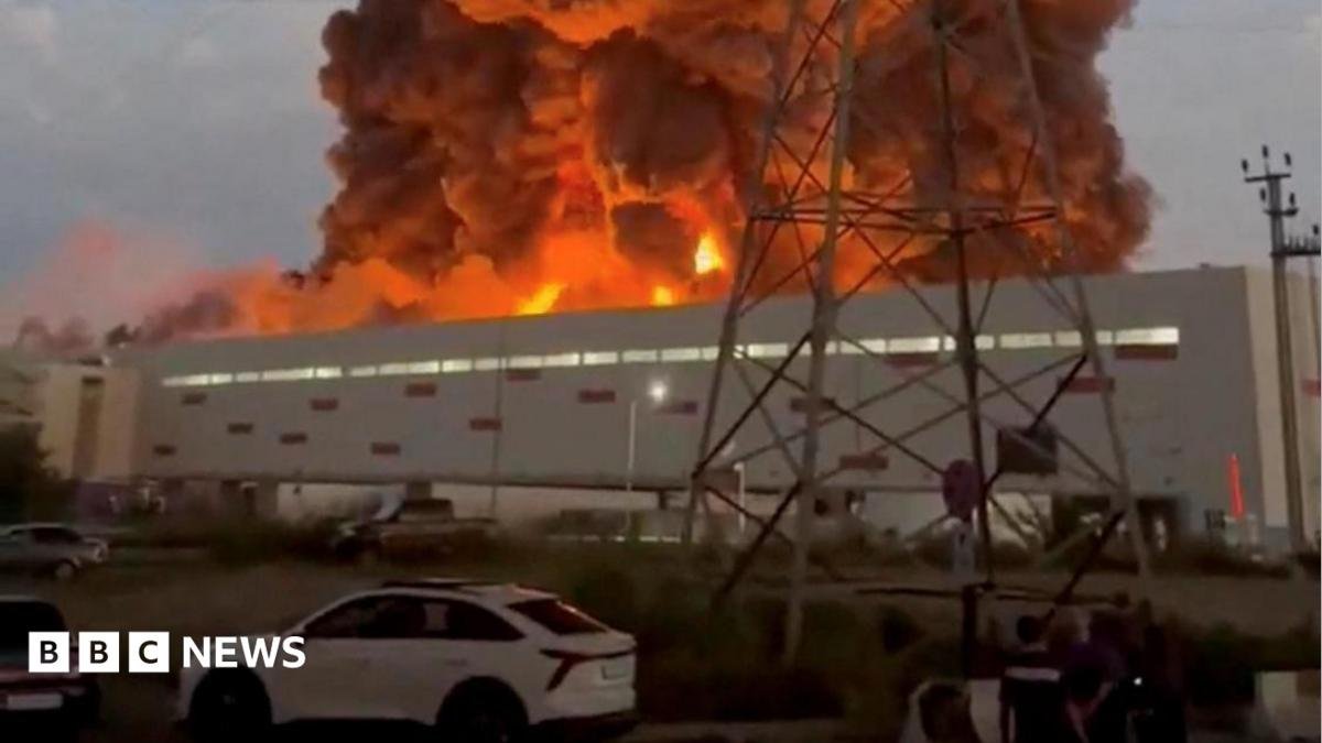 Smoke rises from a Wildberries warehouse on fire after an attack in Nevinnomyssk, Russia, July 22, 2026