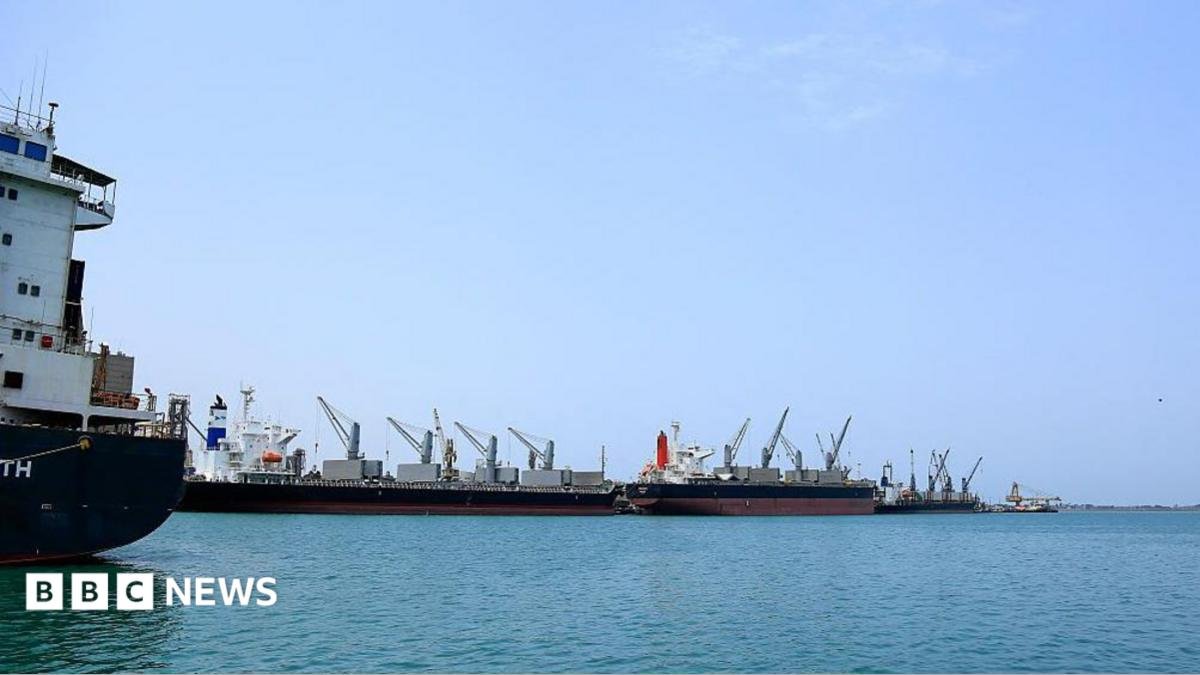 Ships unload their cargo at the port of Yemen's Huthi-held city of Hodeida on July 28, 2024