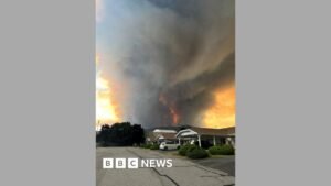 Fast-moving Canada wildfire doubles in size forcing thousands to flee homes | ACTPnews
