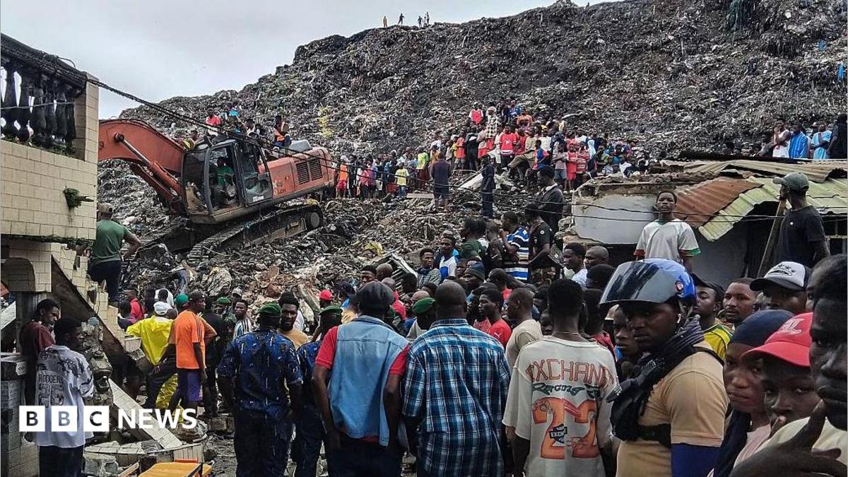Rescuers use an excavator to comb through a mountain of scattered rubbish at a major waste site in Conakry, Guinea, as local residents gather nearby. Photo: 23 August 2026