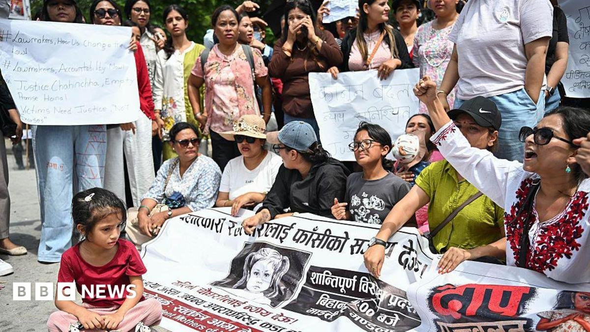 A child participates in a protest in Kathmandu, Nepal, on 22 August 2026, demanding justice for a three-year-old girl in Bara district, who was raped and killed.