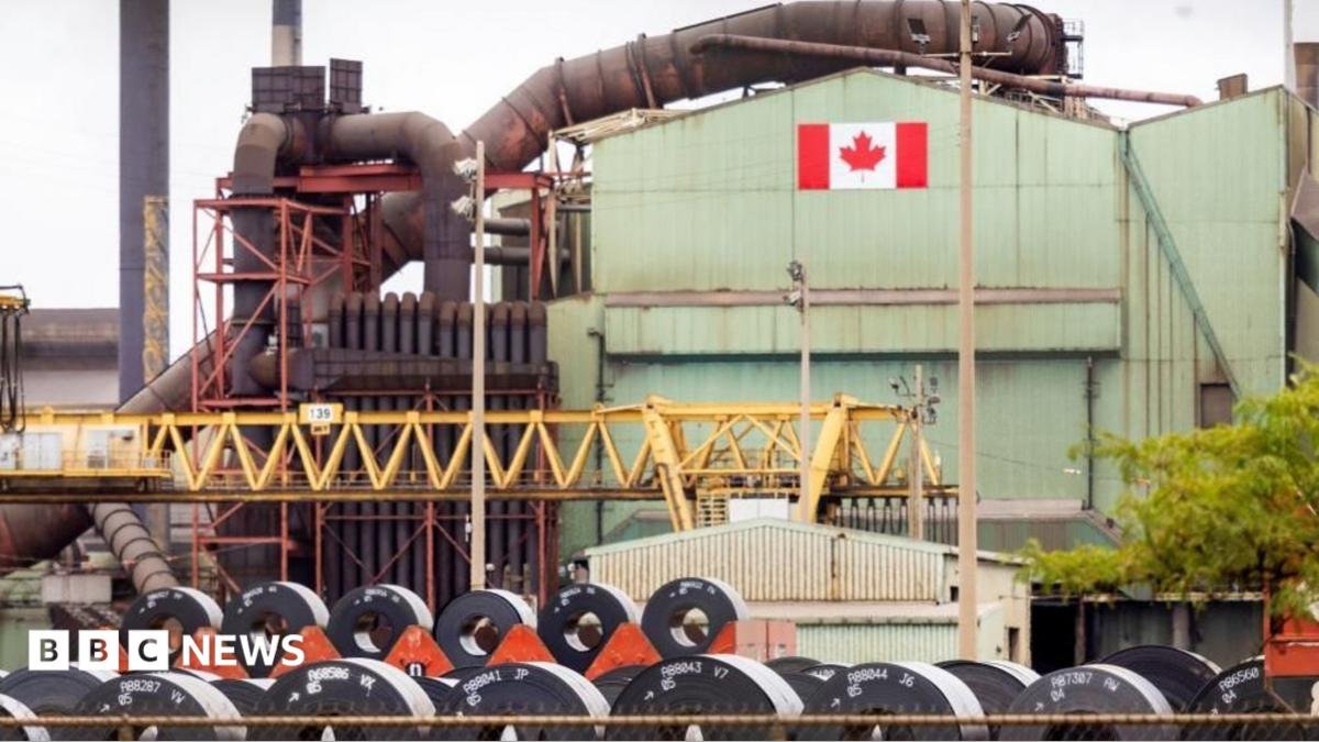 A Canadian flag visible on the ArcelorMittal Dofasco steel plant in Hamilton.
