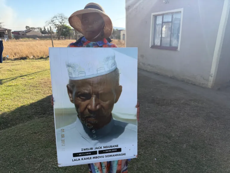 Samukelisiwe Ngubane, a community activist in Nquthu, holds a photograph of her grandfather, Zwelibi Jack Ngubane