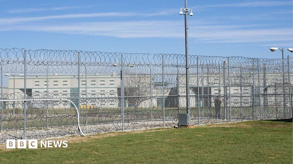 A fence, barbed wire and a guard are visible at the Allan B. Polunsky Unit, the prison that houses the men on Texas' death row in Livingston, Texas