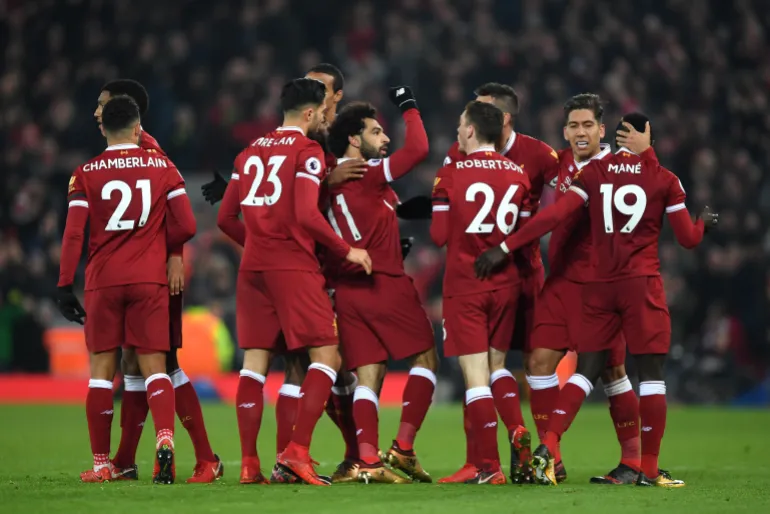 LIVERPOOL, ENGLAND - JANUARY 14: Mohamed Salah of Liverpool celebrates with team mates after scoring the fourth Liverpool goal during the Premier League match between Liverpool and Manchester City at Anfield on January 14, 2018 in Liverpool, England. (Photo by Shaun Botterill/Getty Images)